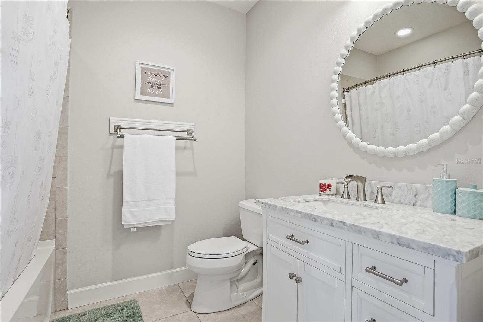Top floor secondary bathroom with tub