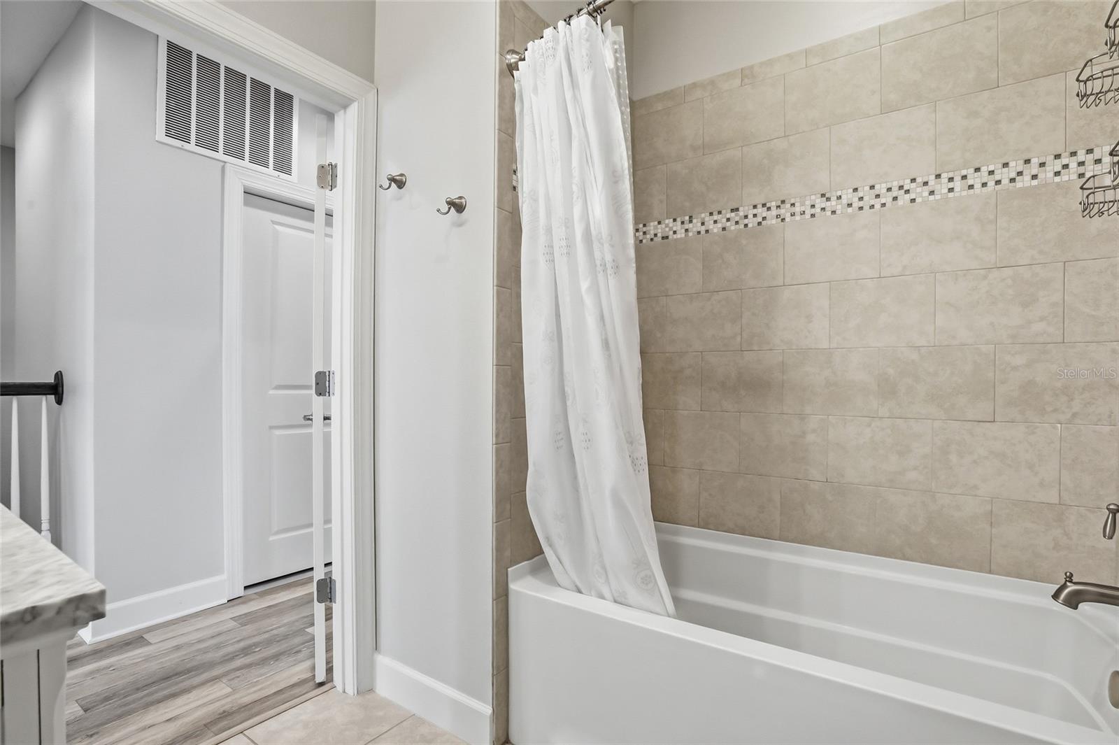 Top floor secondary bathroom with tub