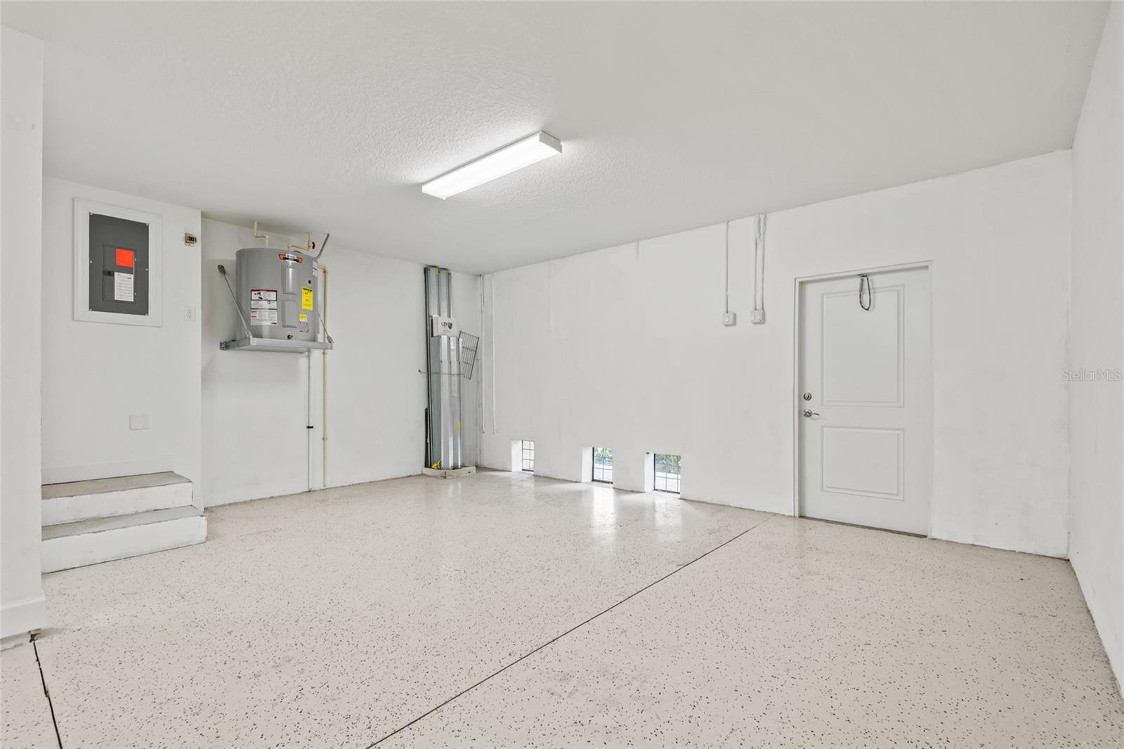 Additional space for bikes or a golf cart.  Door goes out to a back patio