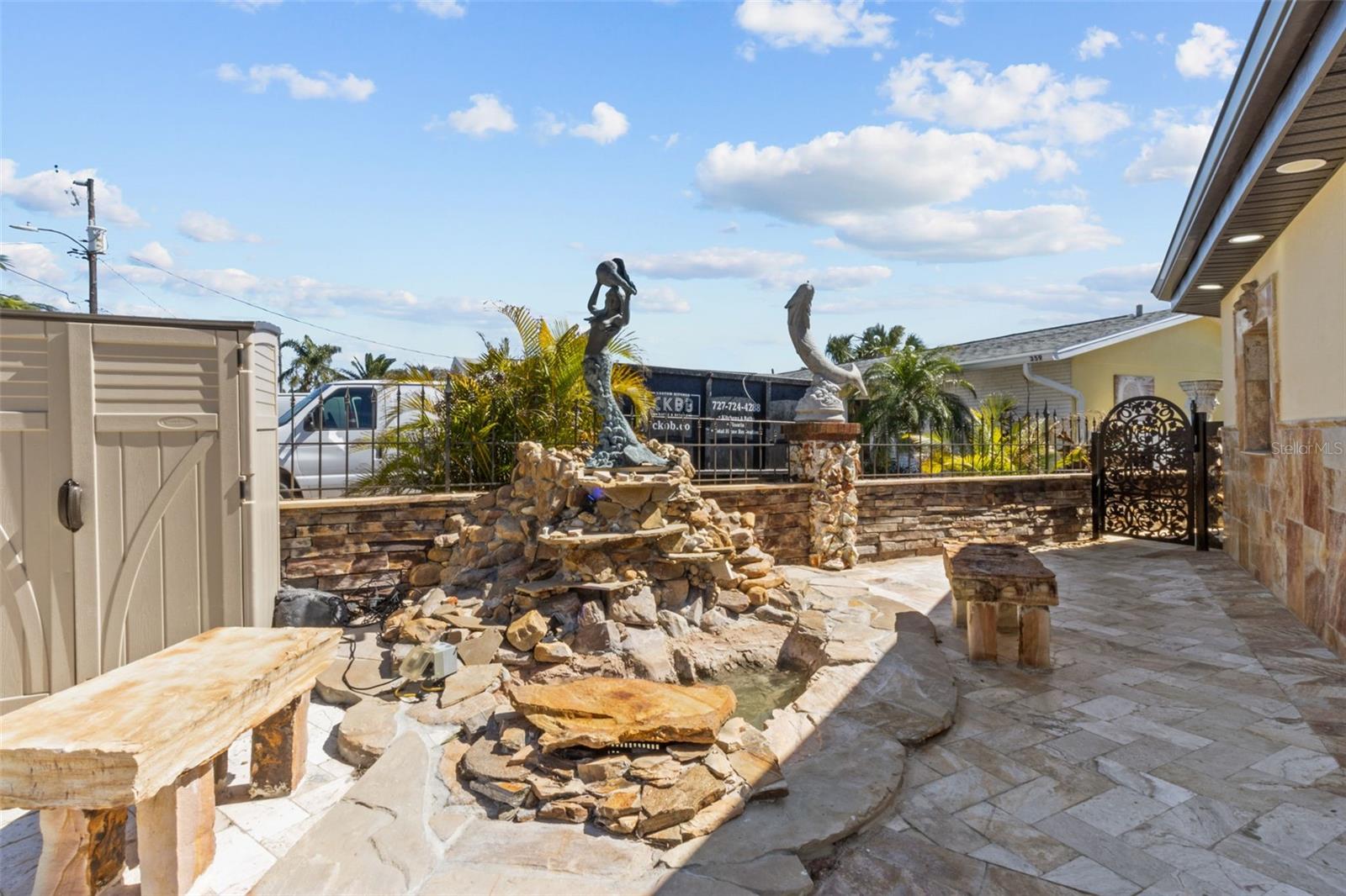 Water features in front of house with fountain