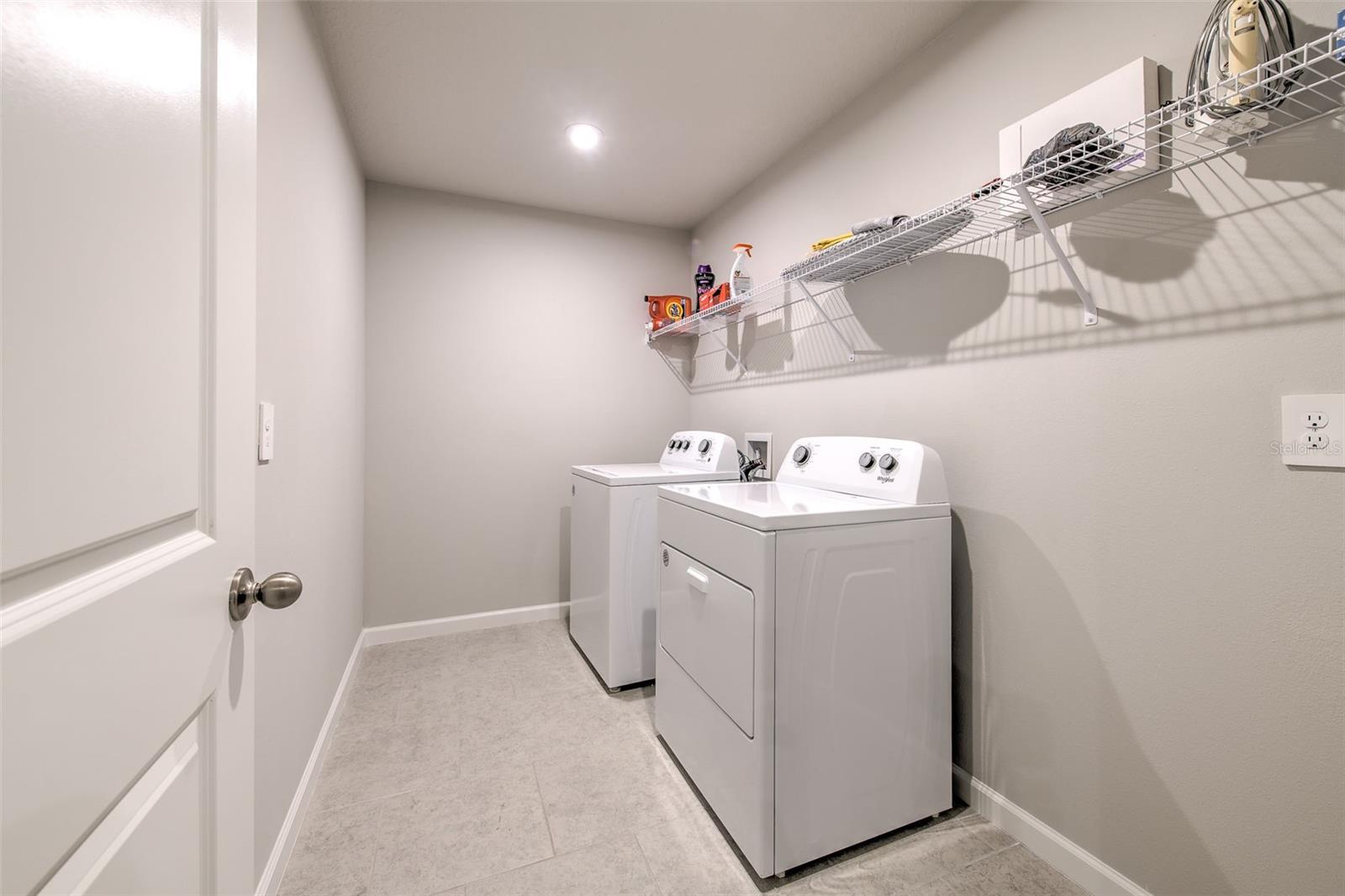Oversized Laundry Room with Shelving