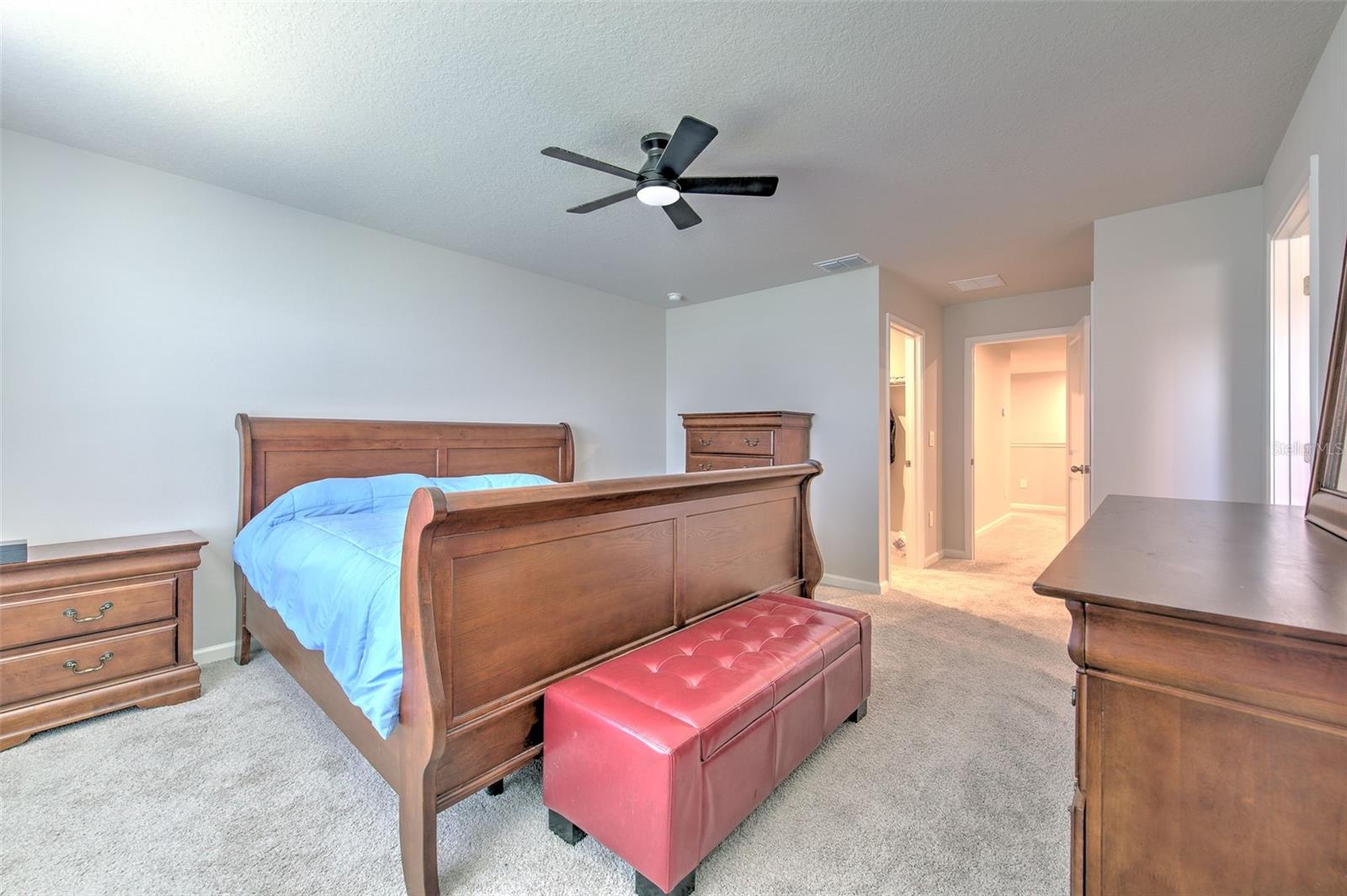 Owner's Suite with Ceiling Fan and Water View