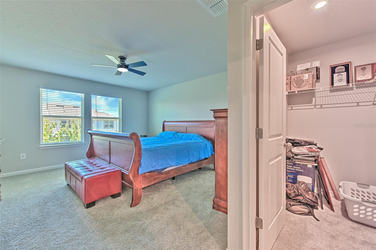 Owner's Suite with Ceiling Fan and Water View