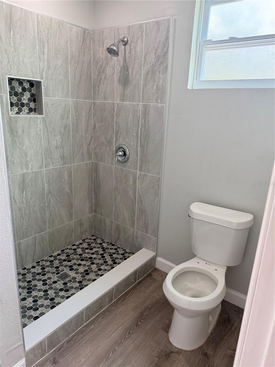 2nd bathroom with stand up shower.