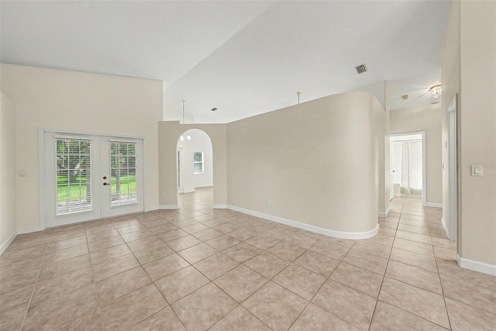 French doors lead to the large back yard