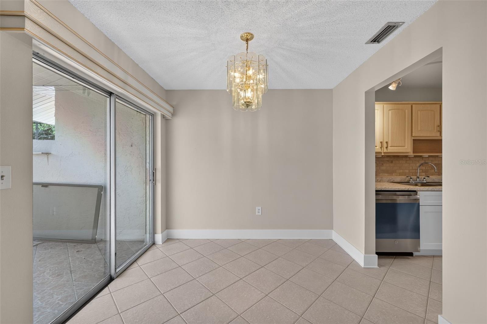 Dining area off kitchen and leading out to the patio
