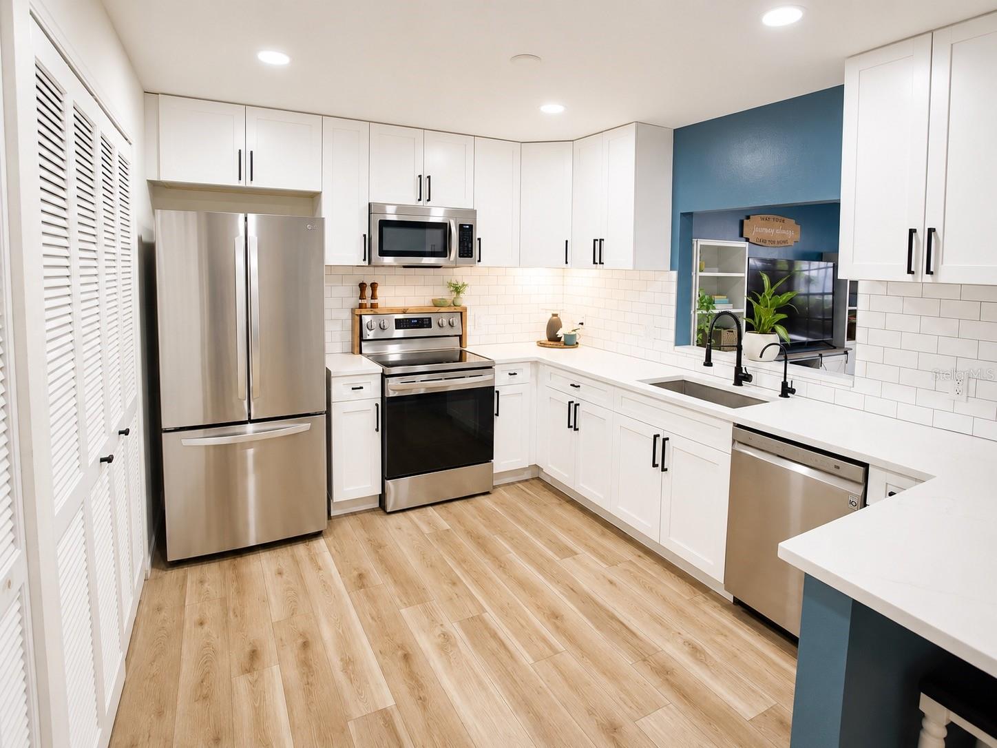 Kitchen – Updated kitchen with ample cabinetry and generous counter space.