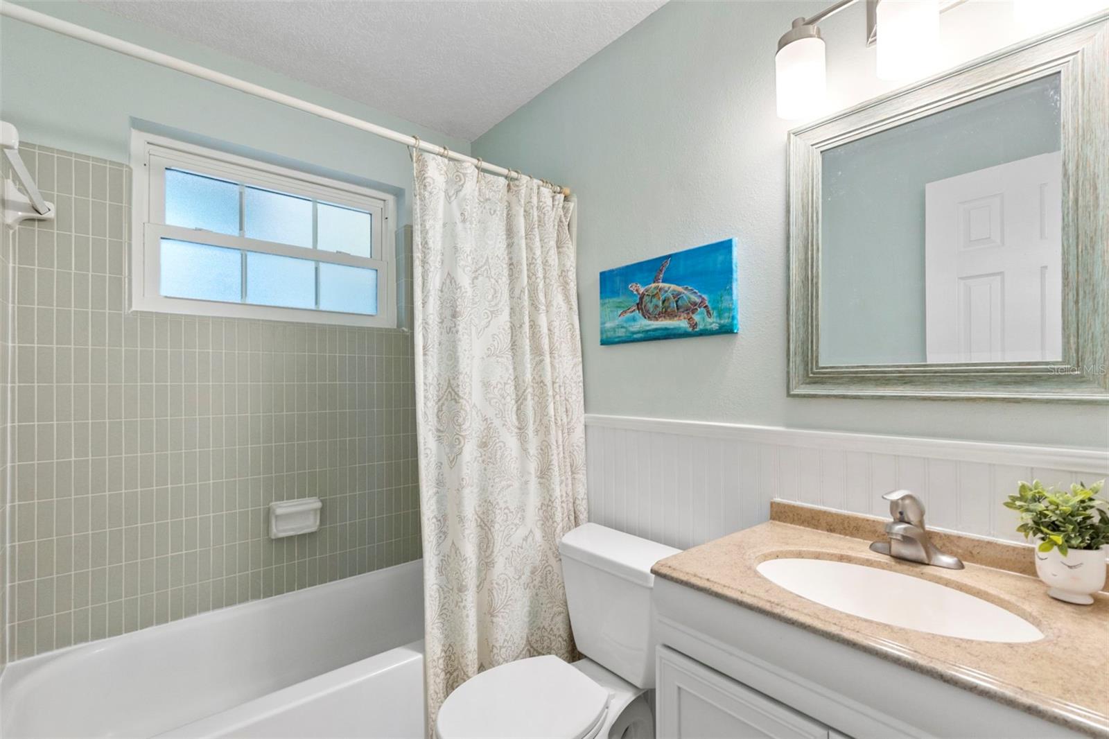 Full bathroom outside of bedroom 2