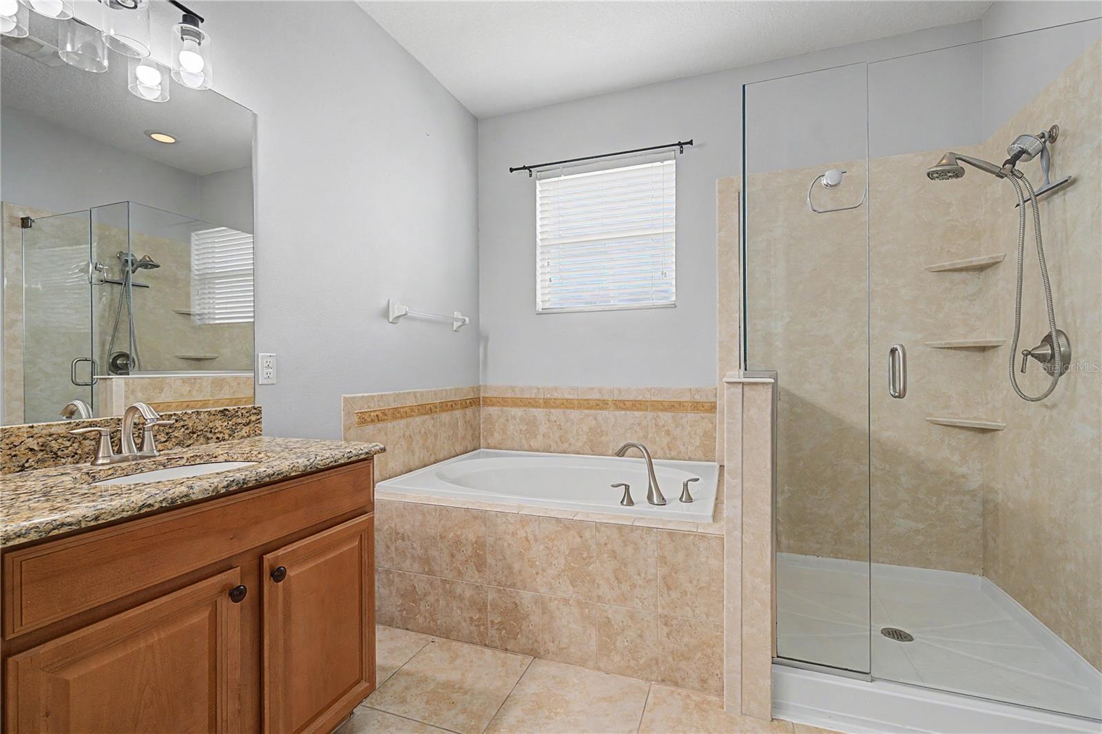 Bath ensuite boast shower and soaking tub