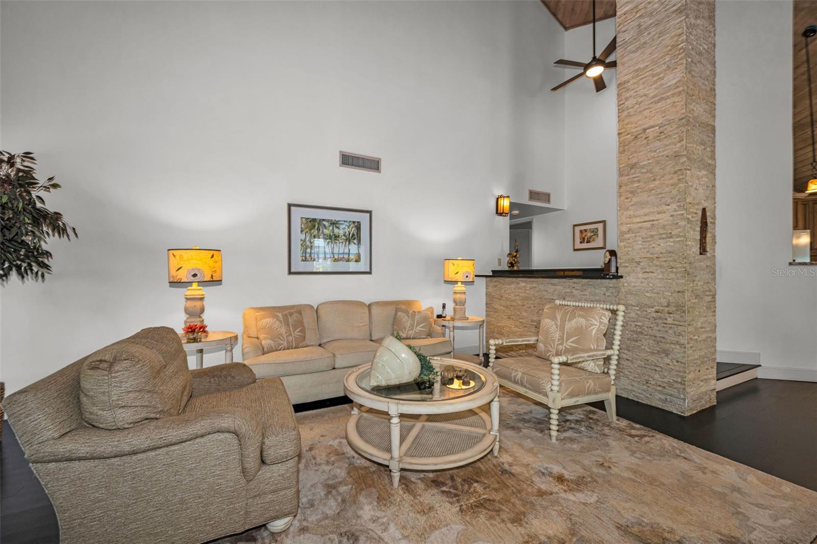Living room with beautiful stacked stone details...