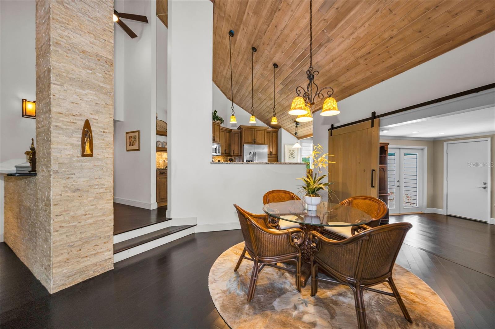 Lovely stacked stone details and the impressive vaulted tongue and groove ceiling are just stunning!