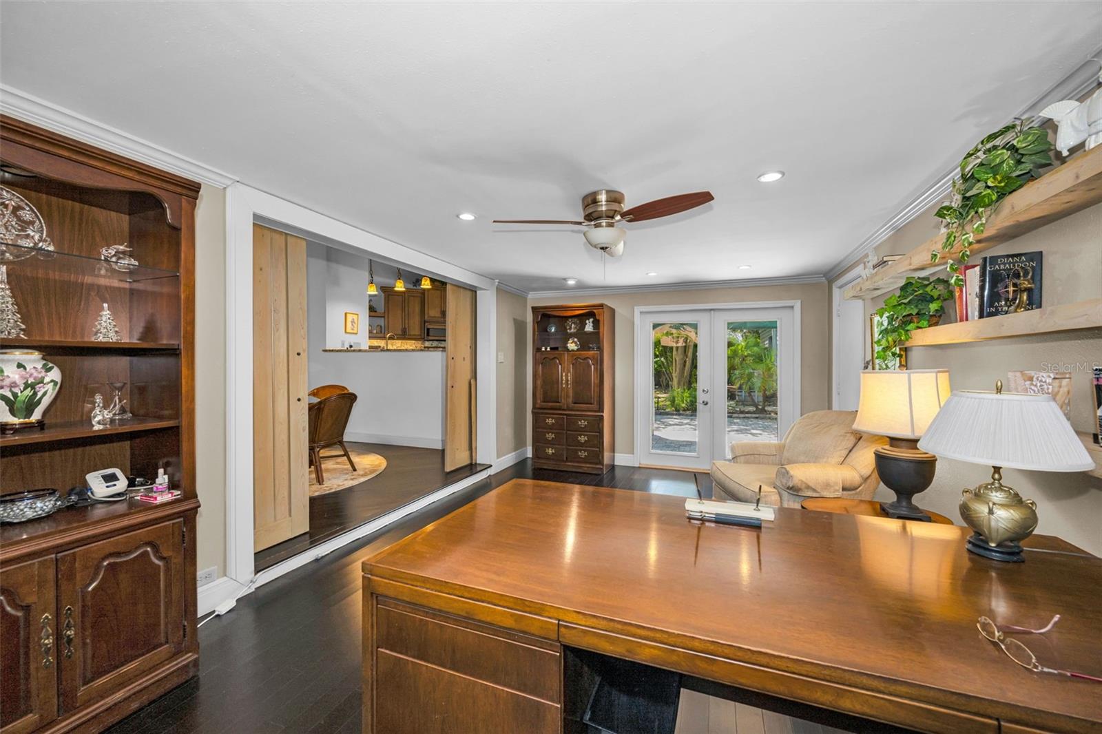 The french doors lead to the back patio which also give you access to the back yard and the pond!