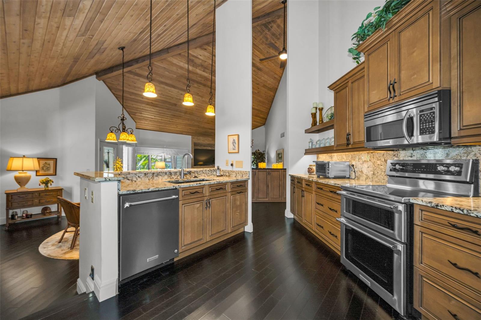The kitchen overlooks the formal dining and the living room.  You are part of the party!