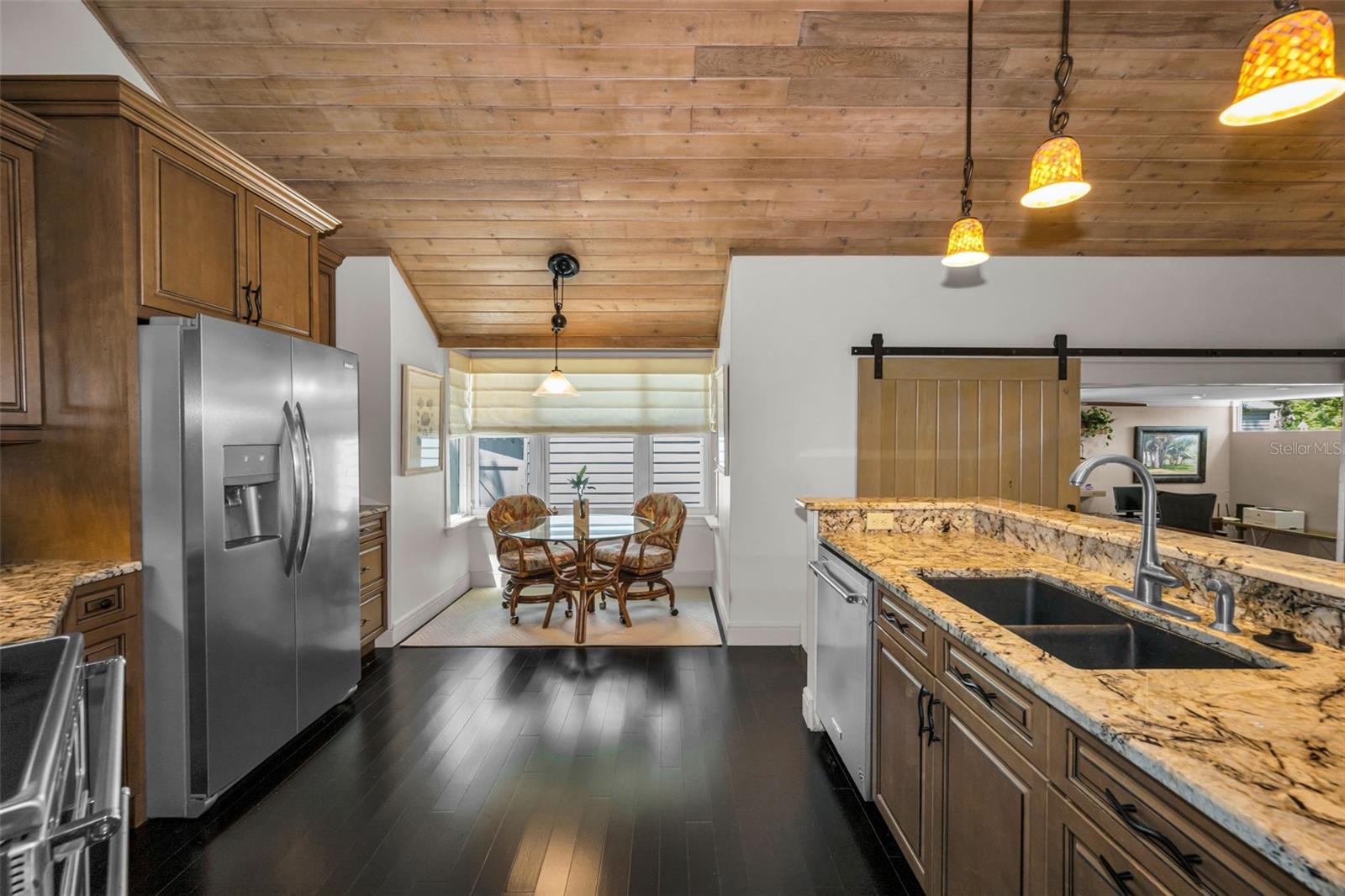 The kitchen has it's share of the tongue and groove ceiling giving it so much warmth and character.