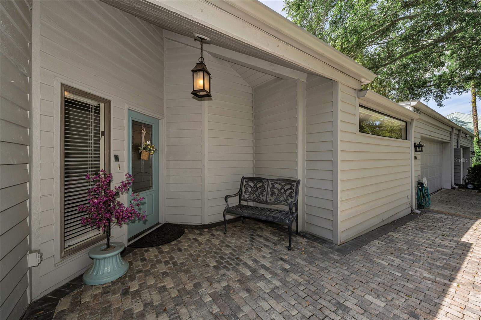 Beautiful pavers surround the charming front door of the 3/2/2 home!