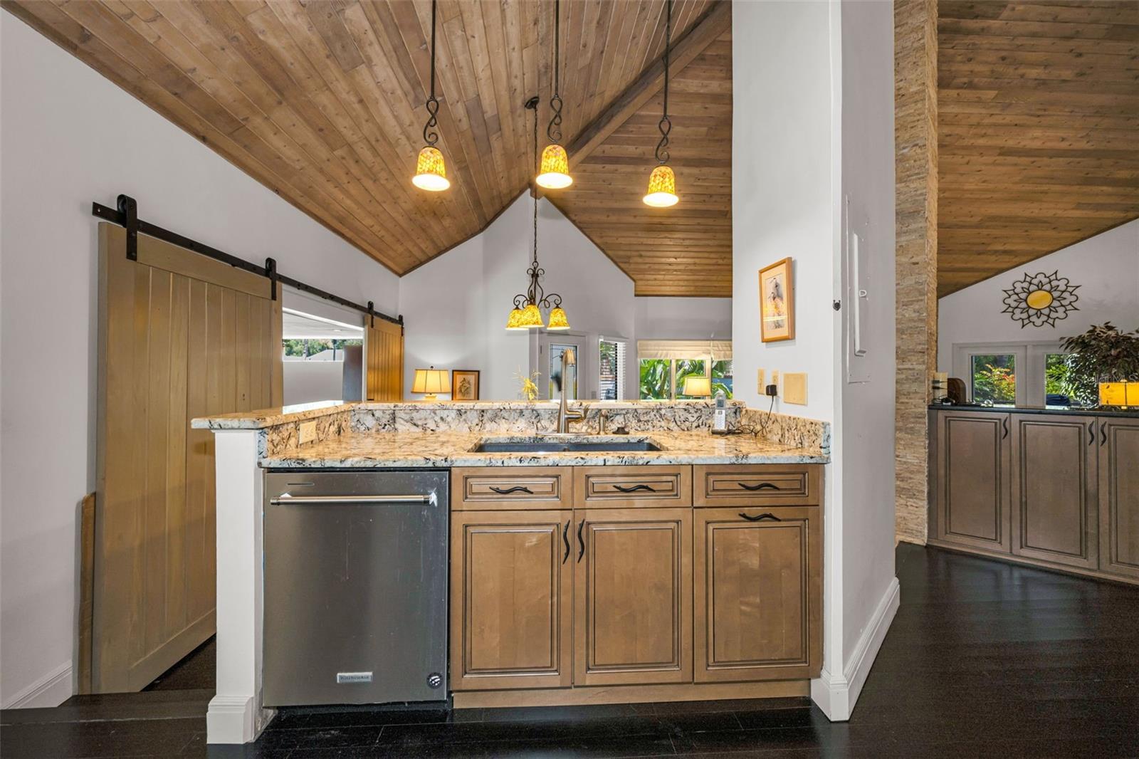 Honey colored cabinets, granite counters and so much storage! Room for all to gather and enjoy!The kitchen overlooks the formal dining area and the spacious living room with the gas fireplace.