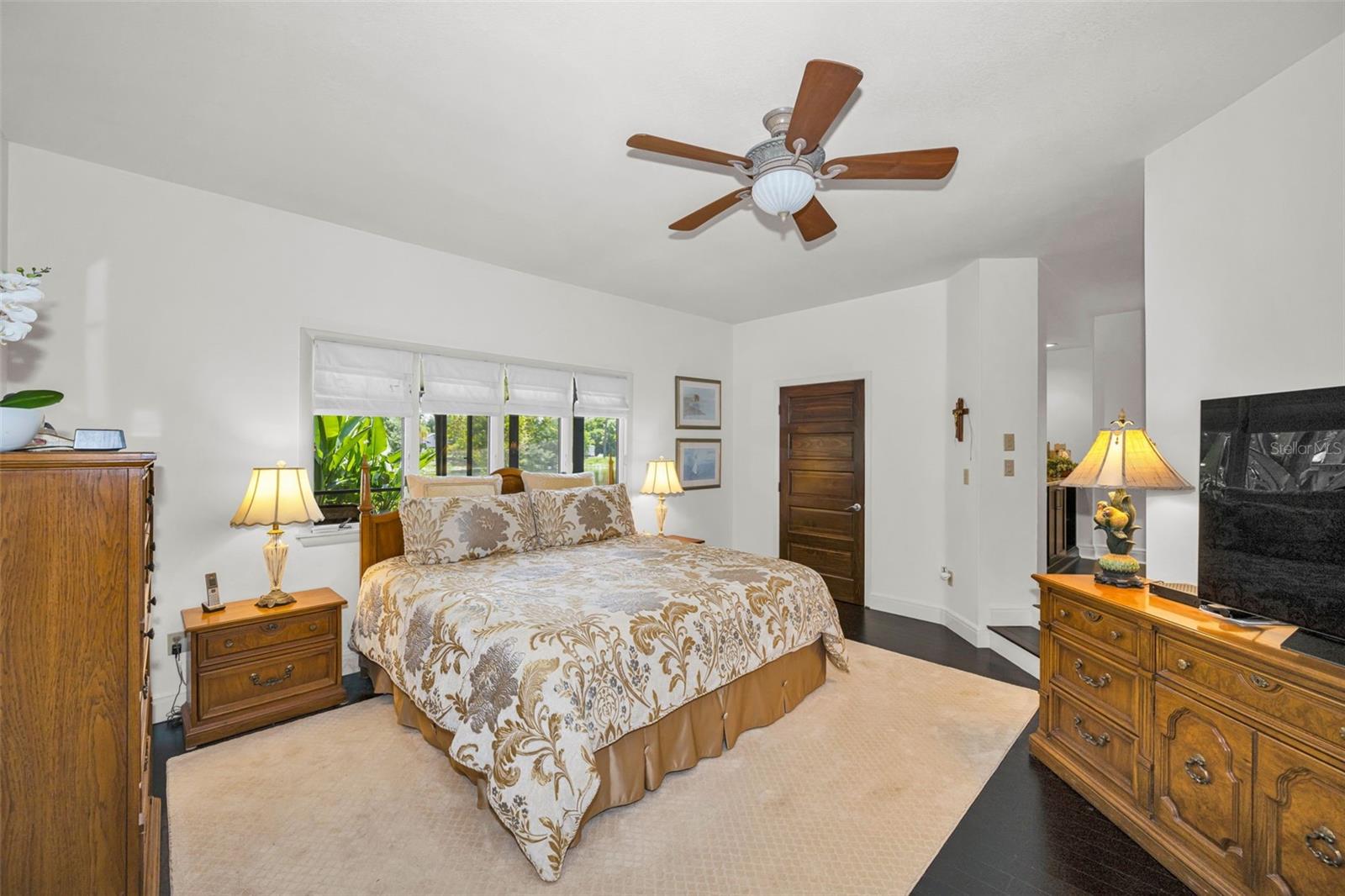 The spacious master suite has a view of the tranquil pond and can accommodate a king bed, double nightstand and dressers and has a walk in closet and a 10' closet and private sitting room.