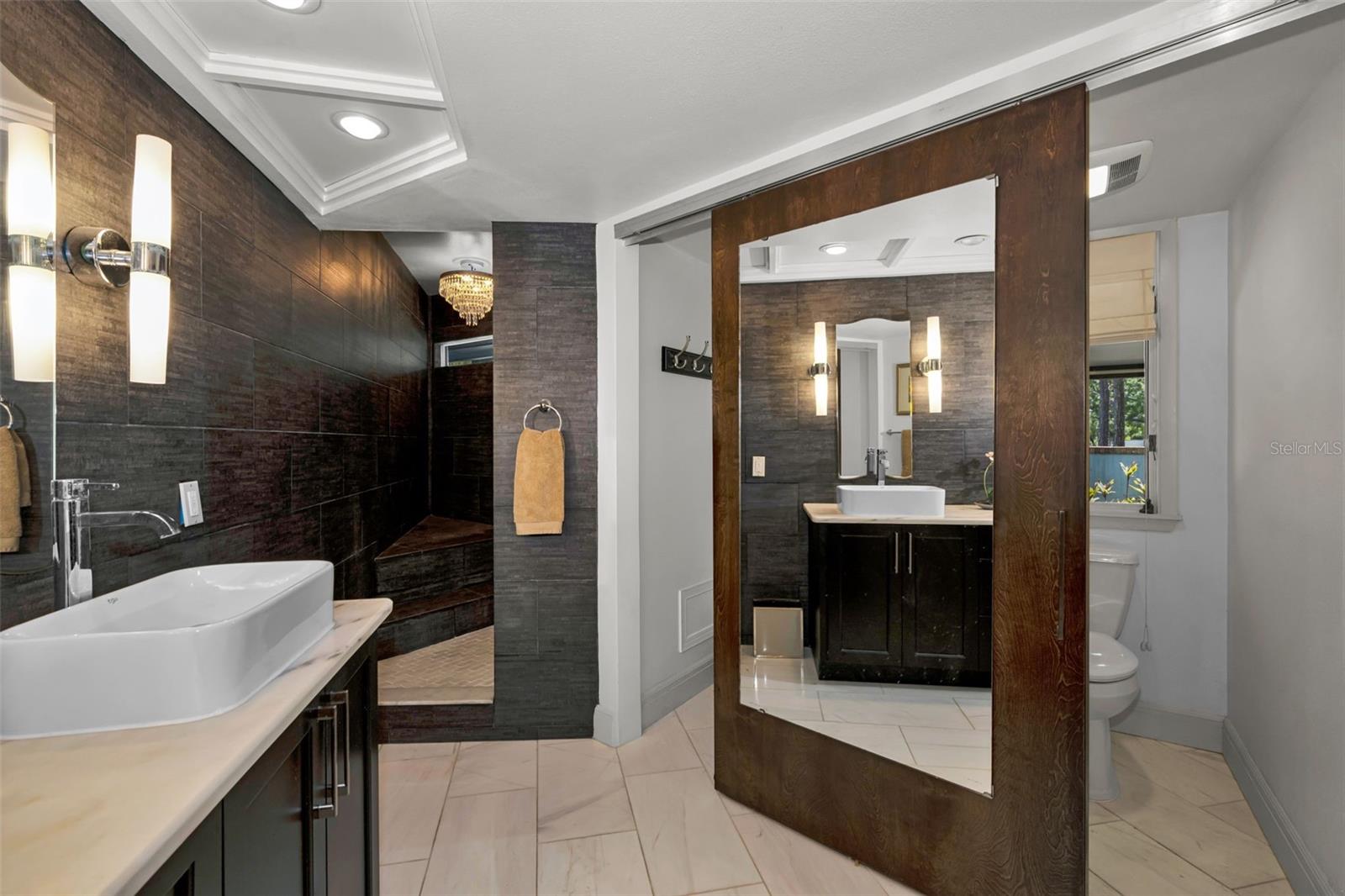 Master bath with linen closet storage and private toilet area. So well designed!