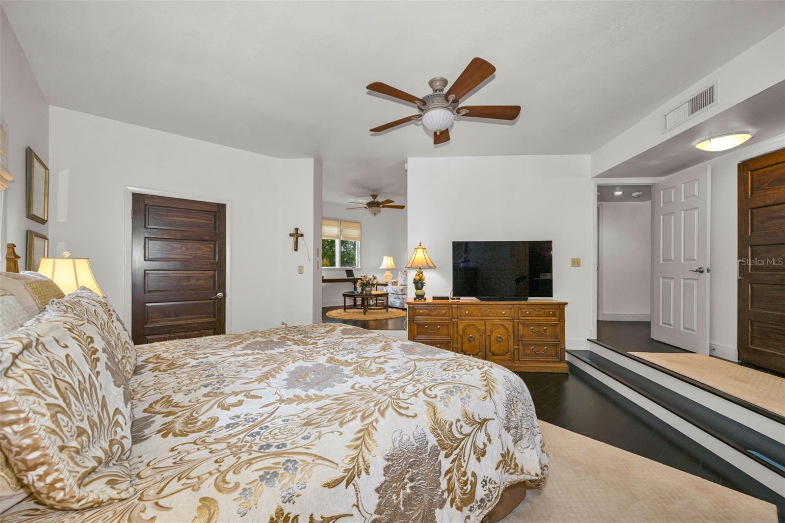Master bedroom entrance showing the walk in closet to the left and the additional 10' closet to your right. In the distance is the private sitting room which can be a third bedroom again or den/office.