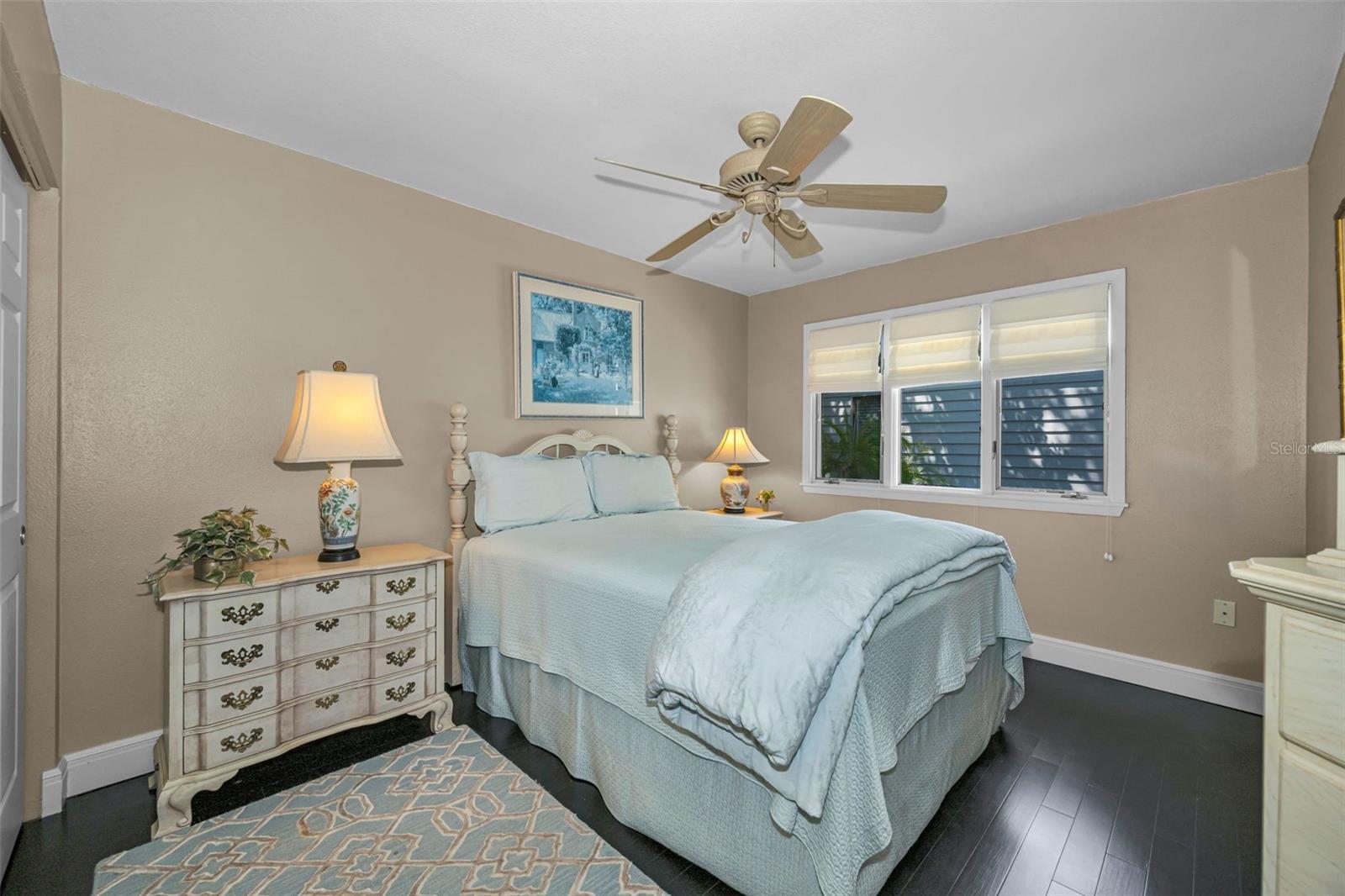 Charming guest bedroom with lots of natural light and a full sized closet.