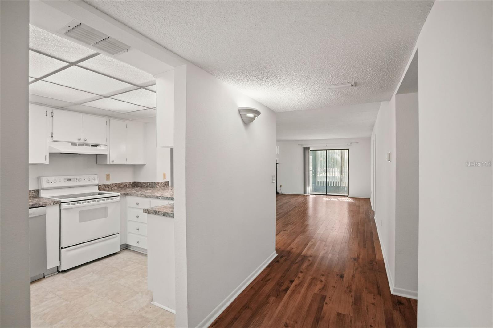 Step Inside. Neutral finishes, durable laminate flooring, and an open living and dining area create a comfortable space that's ready for your personal style.