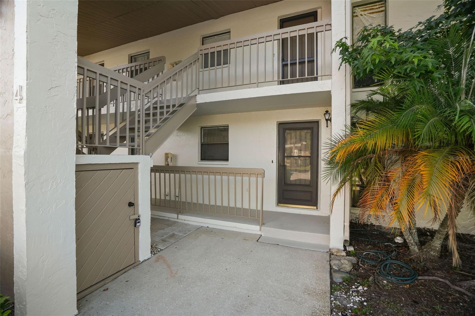 A covered ground-floor entrance with a front patio offers easy, step-free access and a warm welcome home.