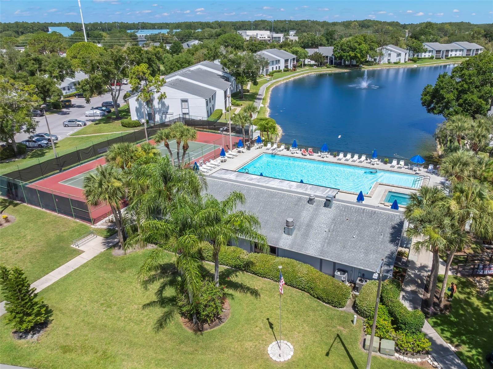 Palm trees, a scenic lake, a heated pool and spa, tennis courts, and beautifully maintained grounds create a true Florida lifestyle.