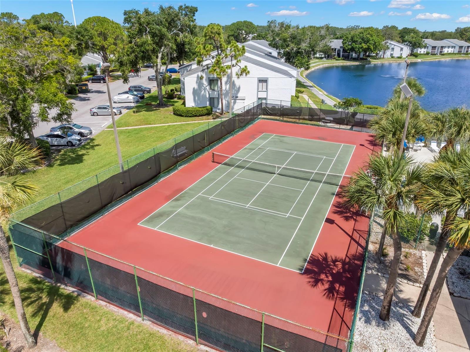 Stay active with the community tennis court, surrounded by scenic lake views and beautifully maintained grounds.