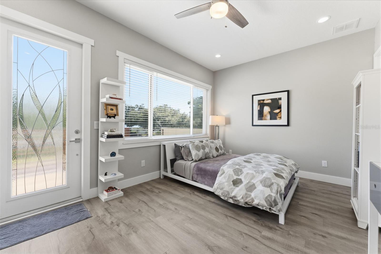 Generous 3rd Bedroom Upstairs with natural light and spacious balcony adding bonus outdoor living