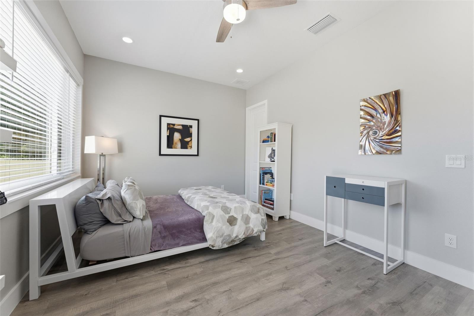 Generous 3rd Bedroom Upstairs with natural light and spacious balcony adding bonus outdoor living