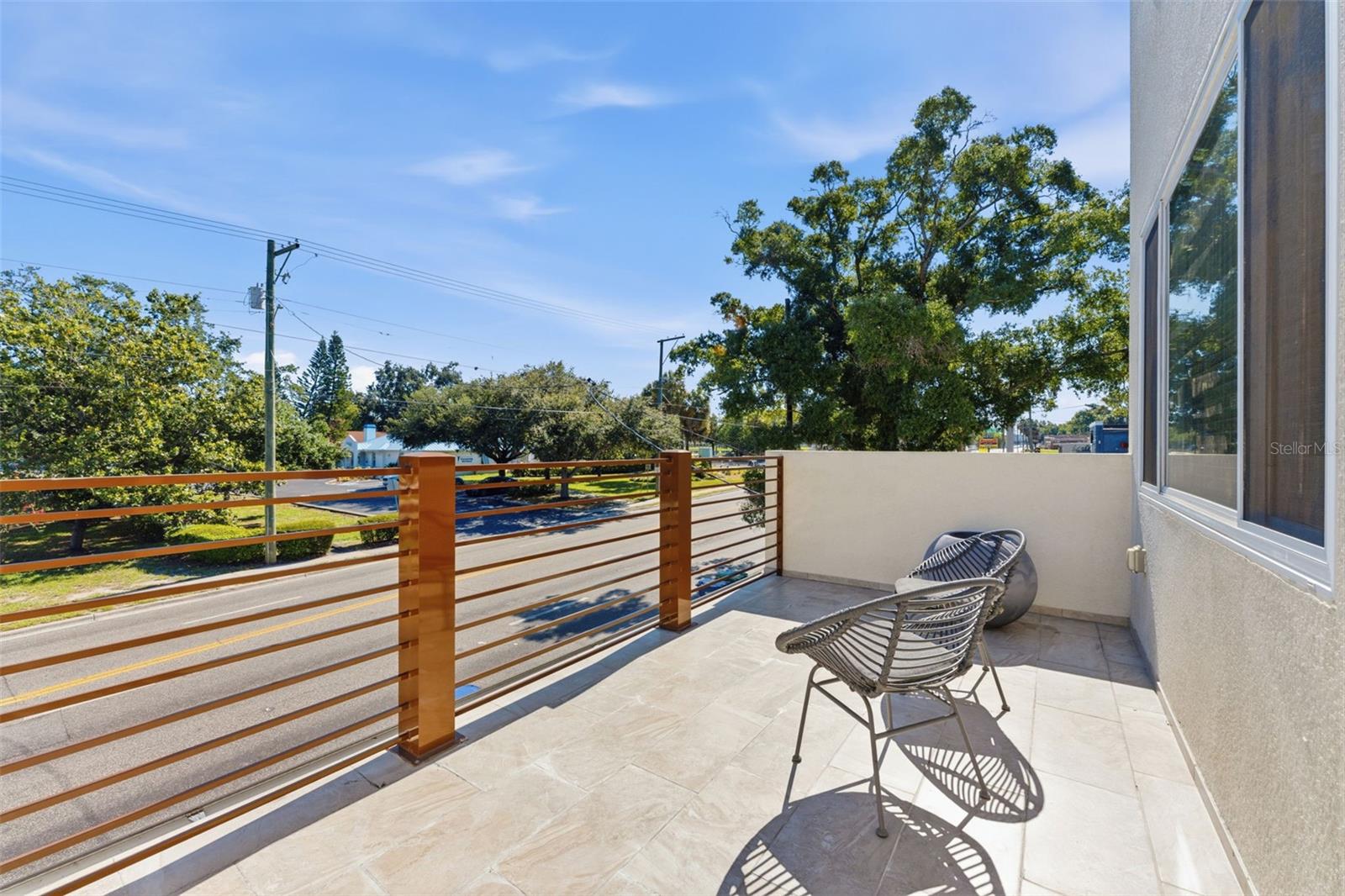 Spacious second-floor balcony off the upstairs bedroom offering bonus outdoor living space