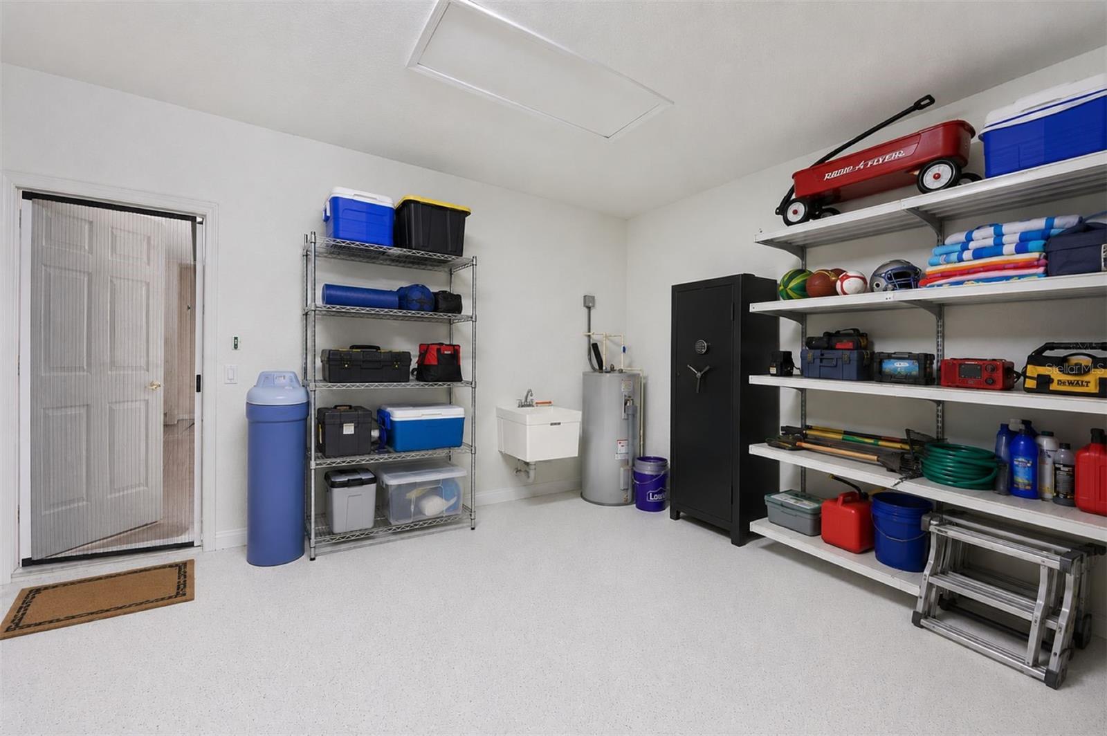Remote opener garage has water softener , sink , safe. Current owner never used the water softner.
