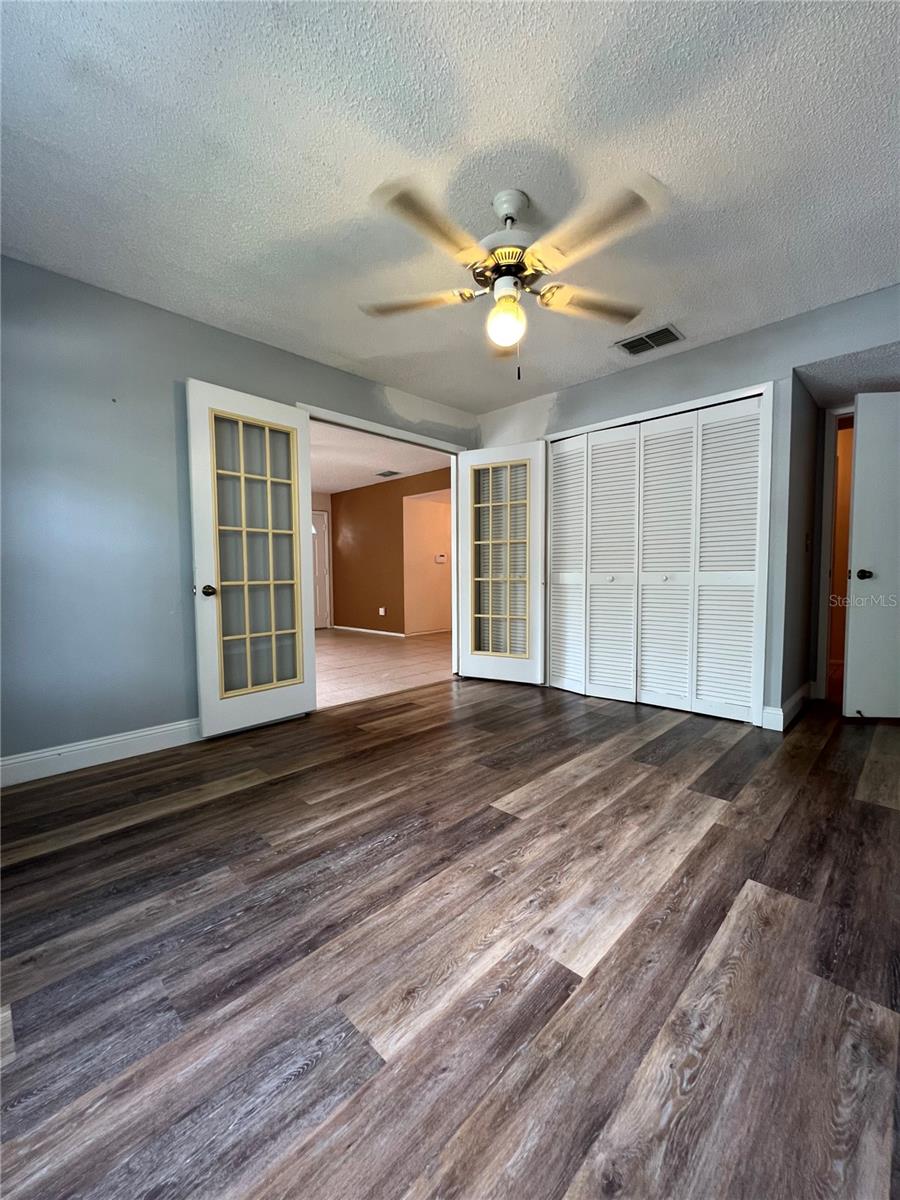 2nd bedroom/office with laminate flooring.