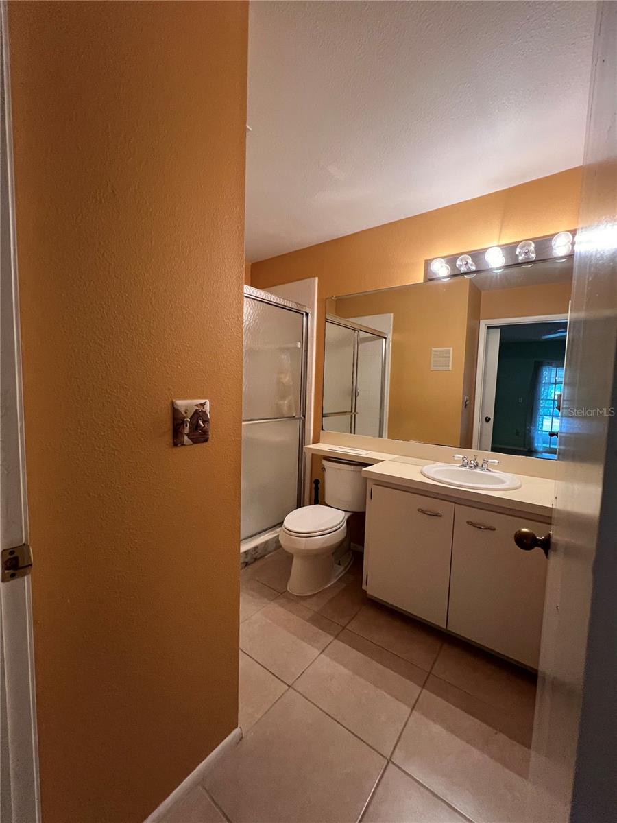 En suite bathroom in primary bedroom.