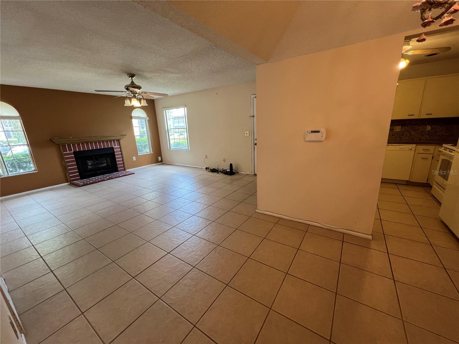 View of living and dining room into the kitchen.