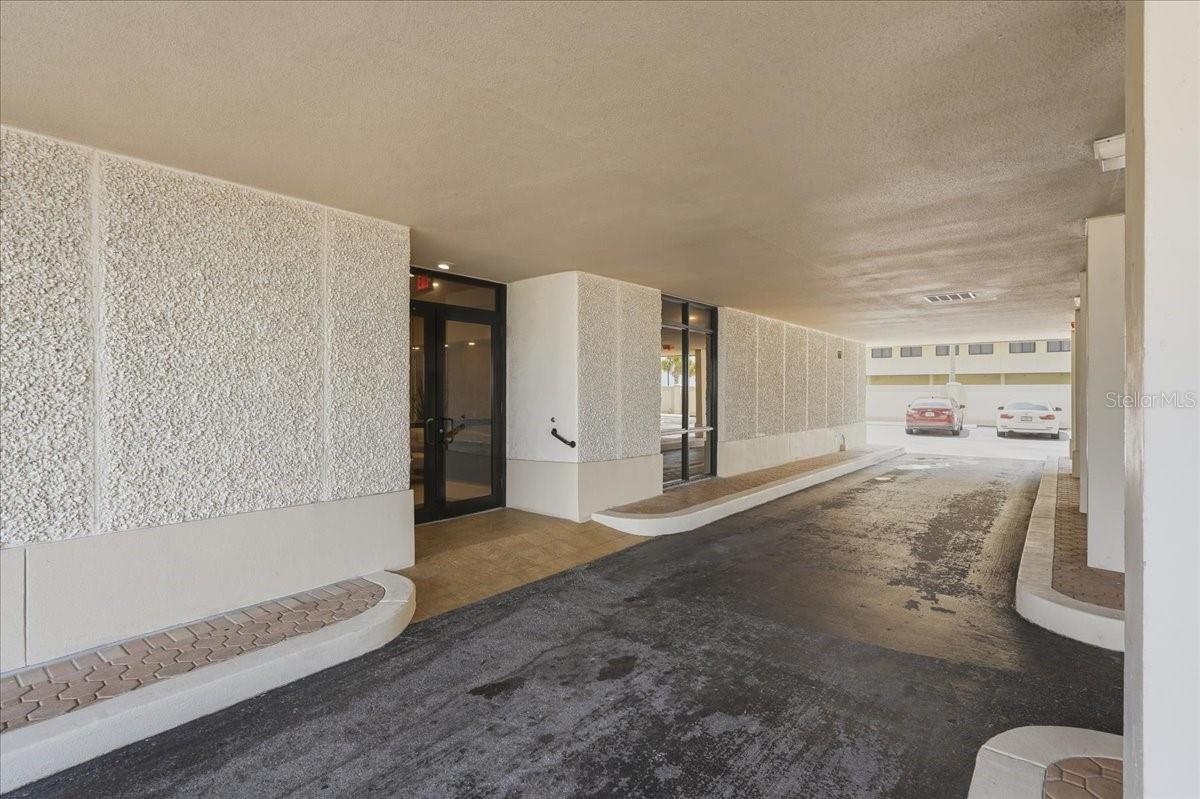 Under the building drop off area to the Lobby