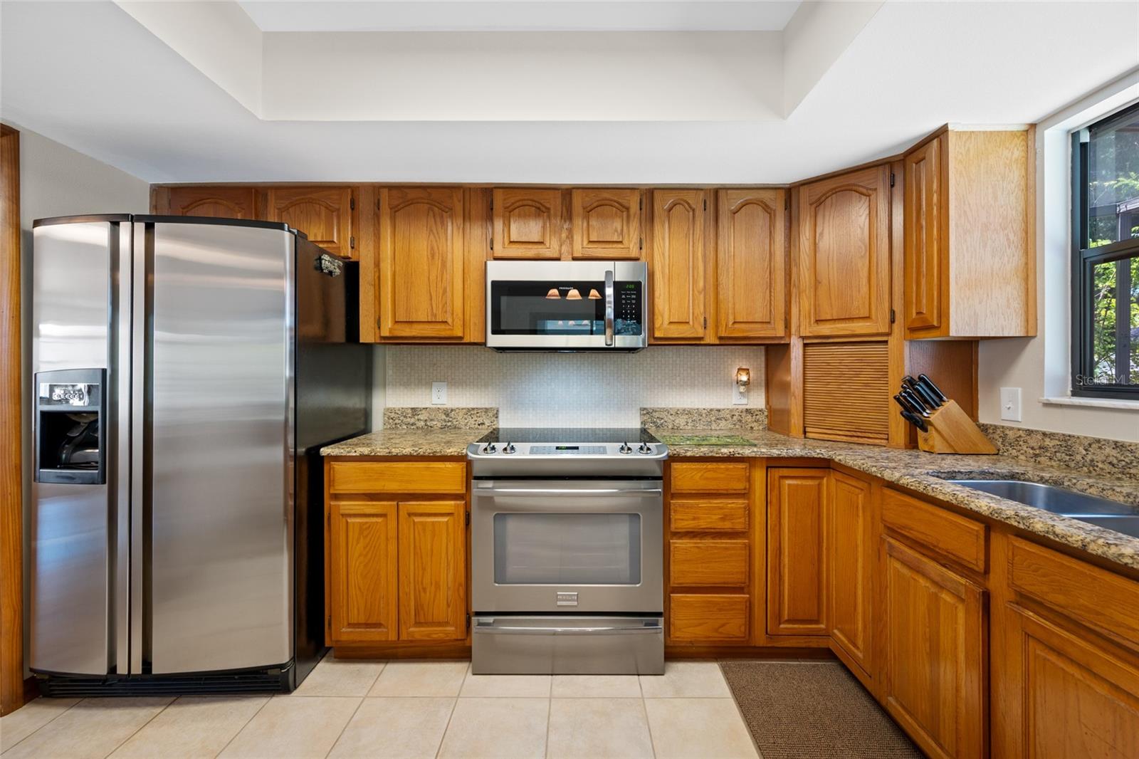 Solid wood cabinetry, granite countertops