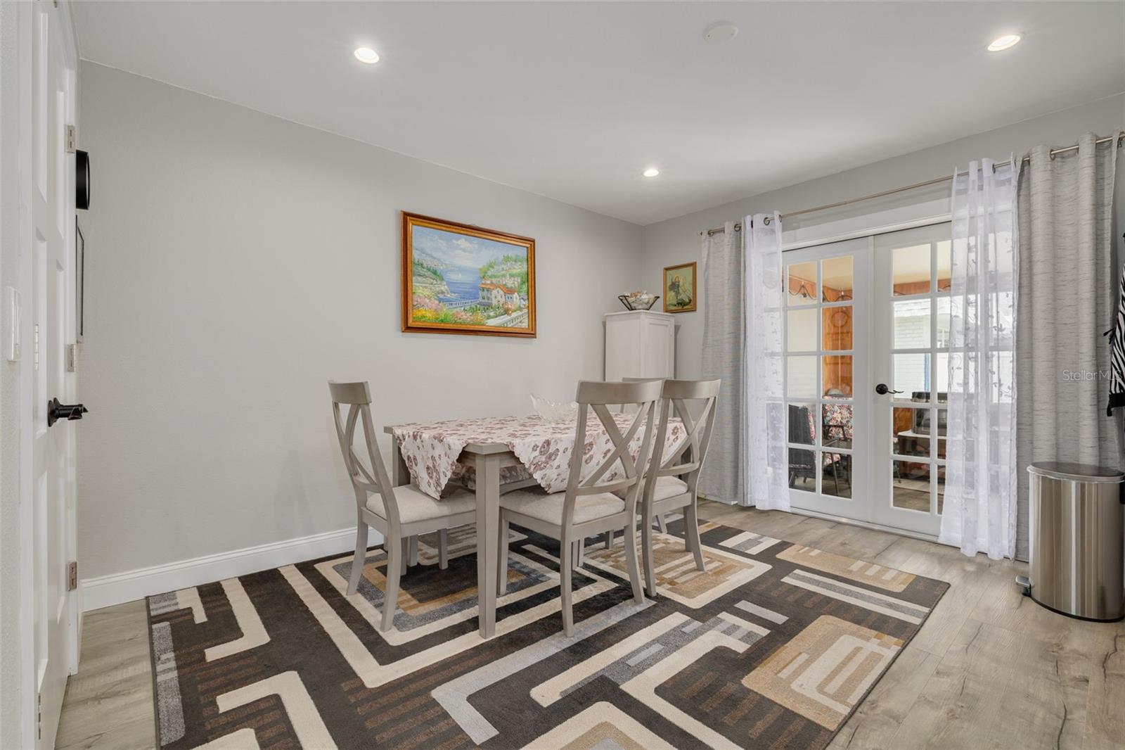 Beautiful upgraded French doors lead to the cozy Florida Room!