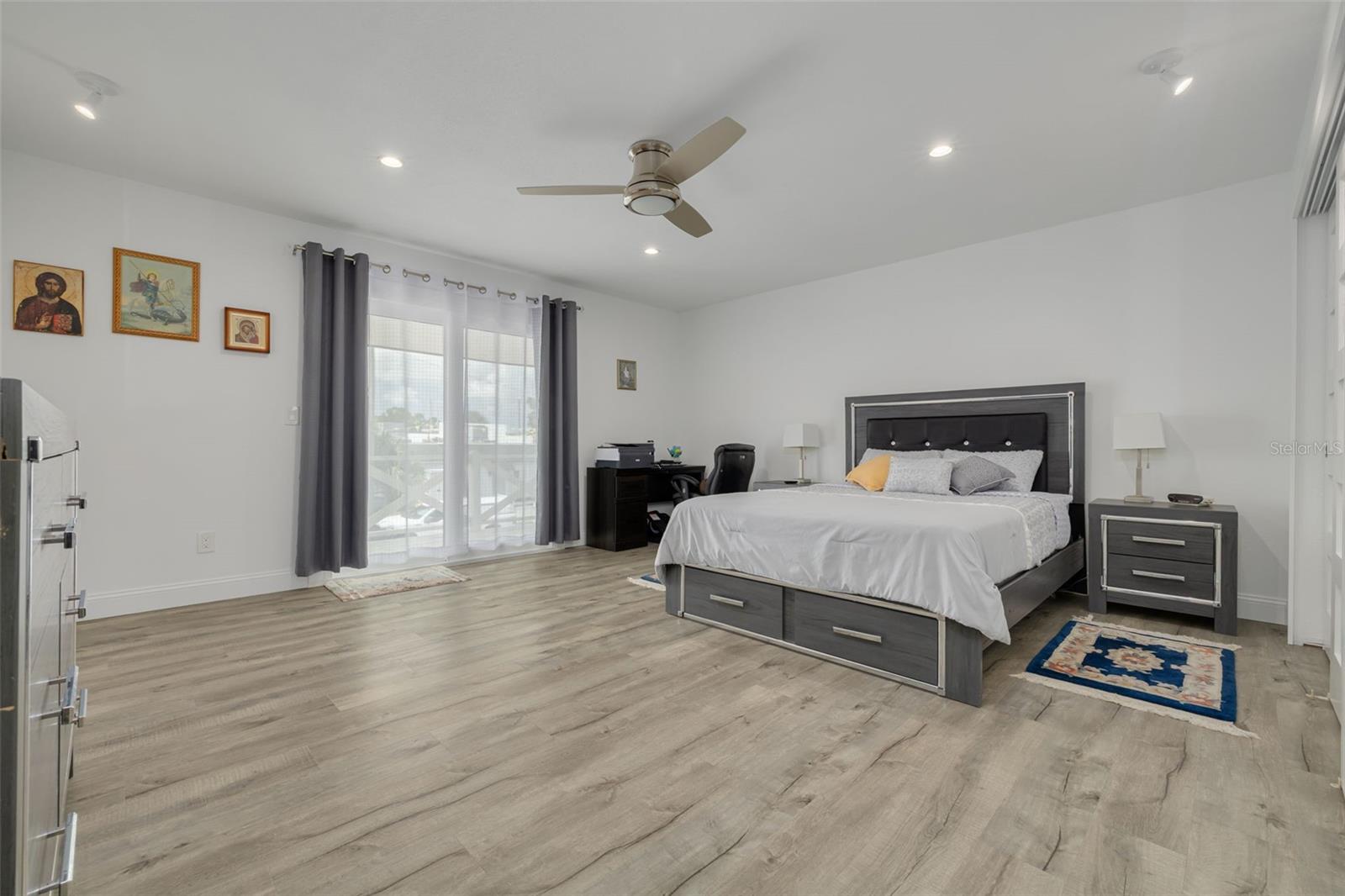 Oversized primary bedroom wtih dual closets and balcony fit for Juliet!