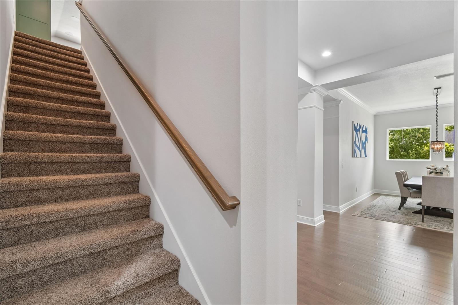 Stairs to bonus room & half bath
