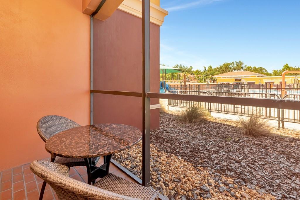Screened patio overlooking pool area