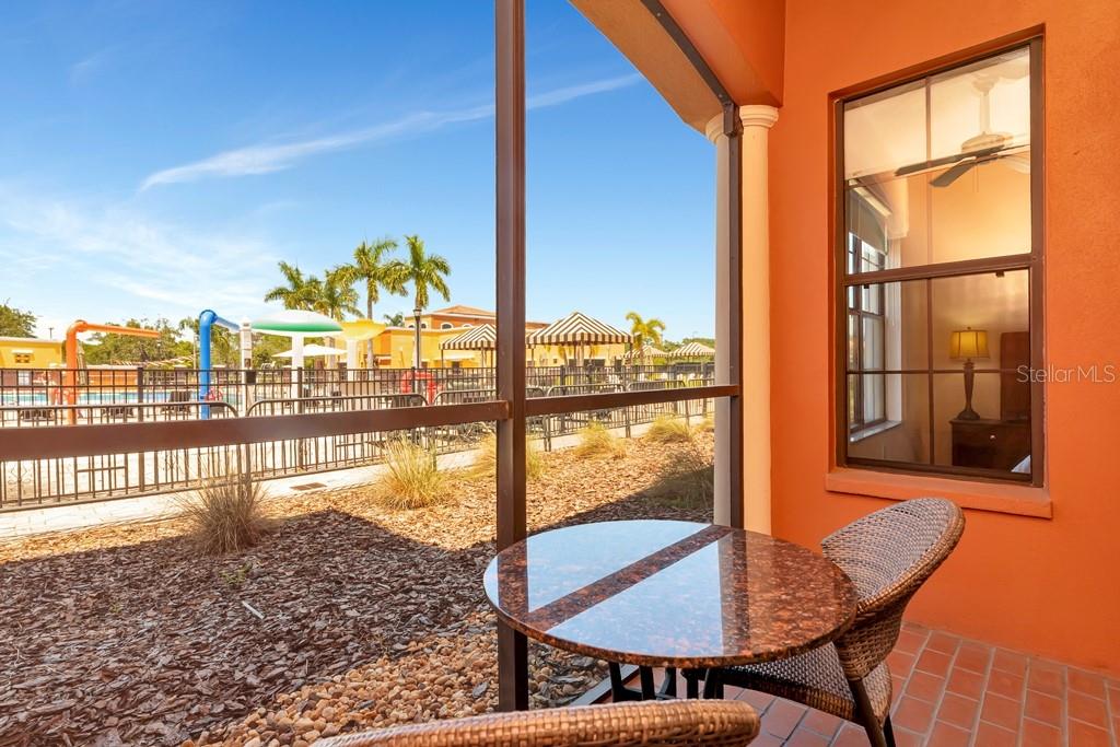 Screened patio overlooking pool area