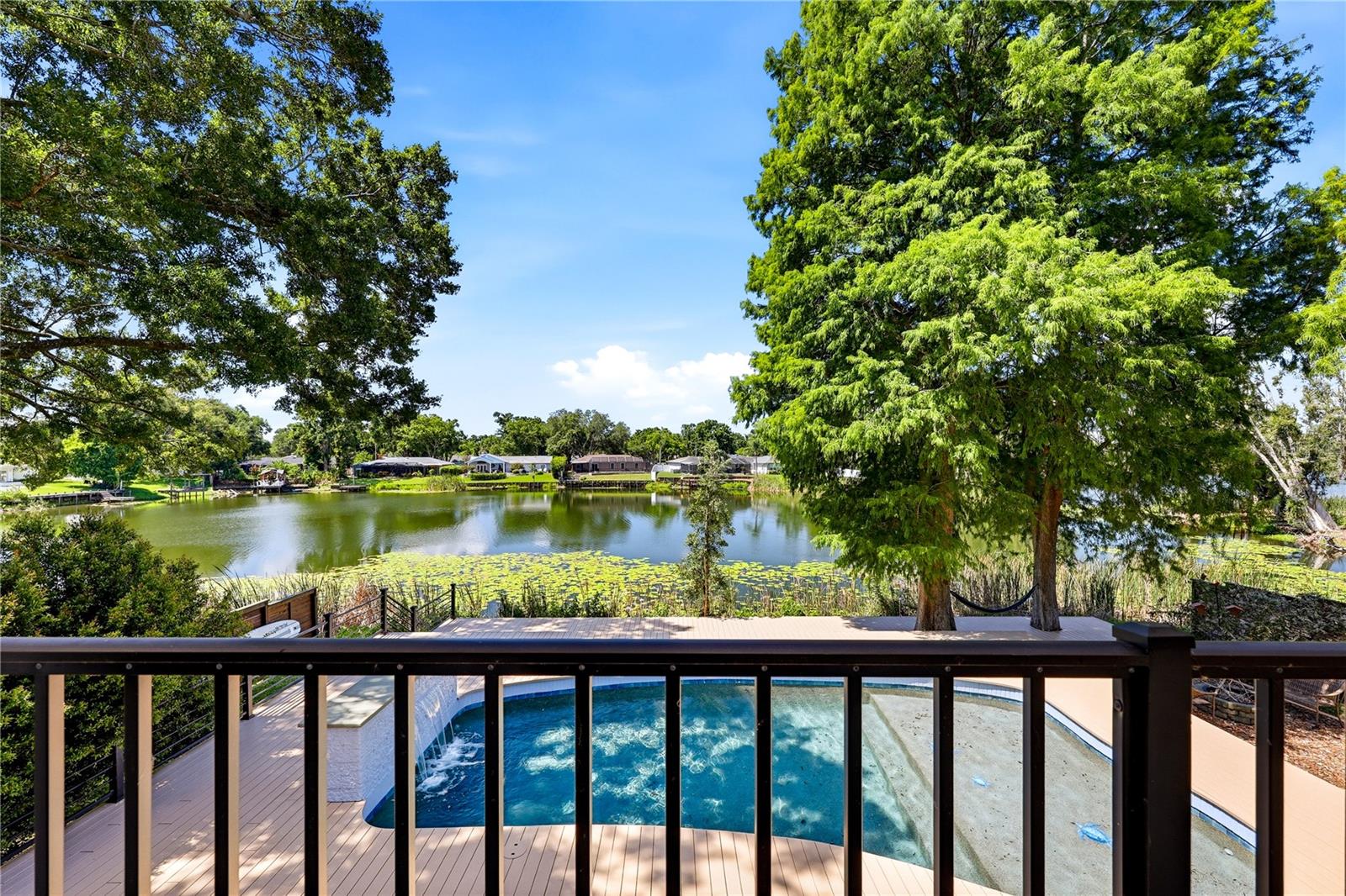 Juliet balcony overlooking pool and lakeviews.