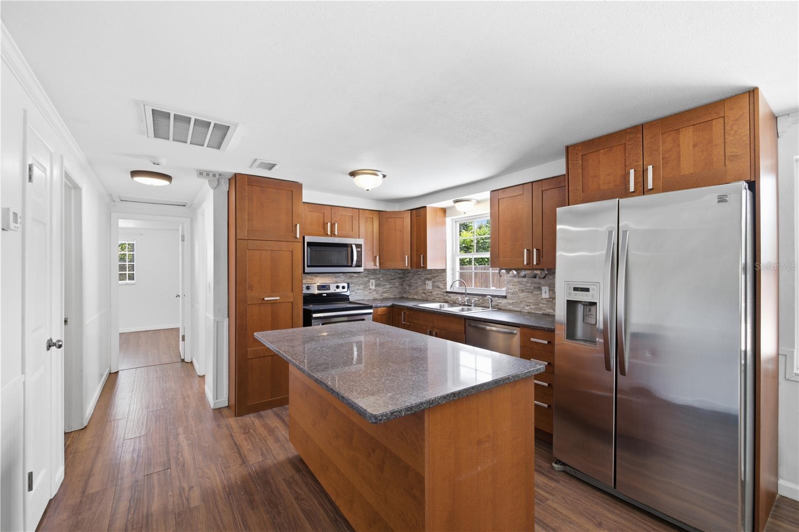 Stainless steel appliances with granite countertop