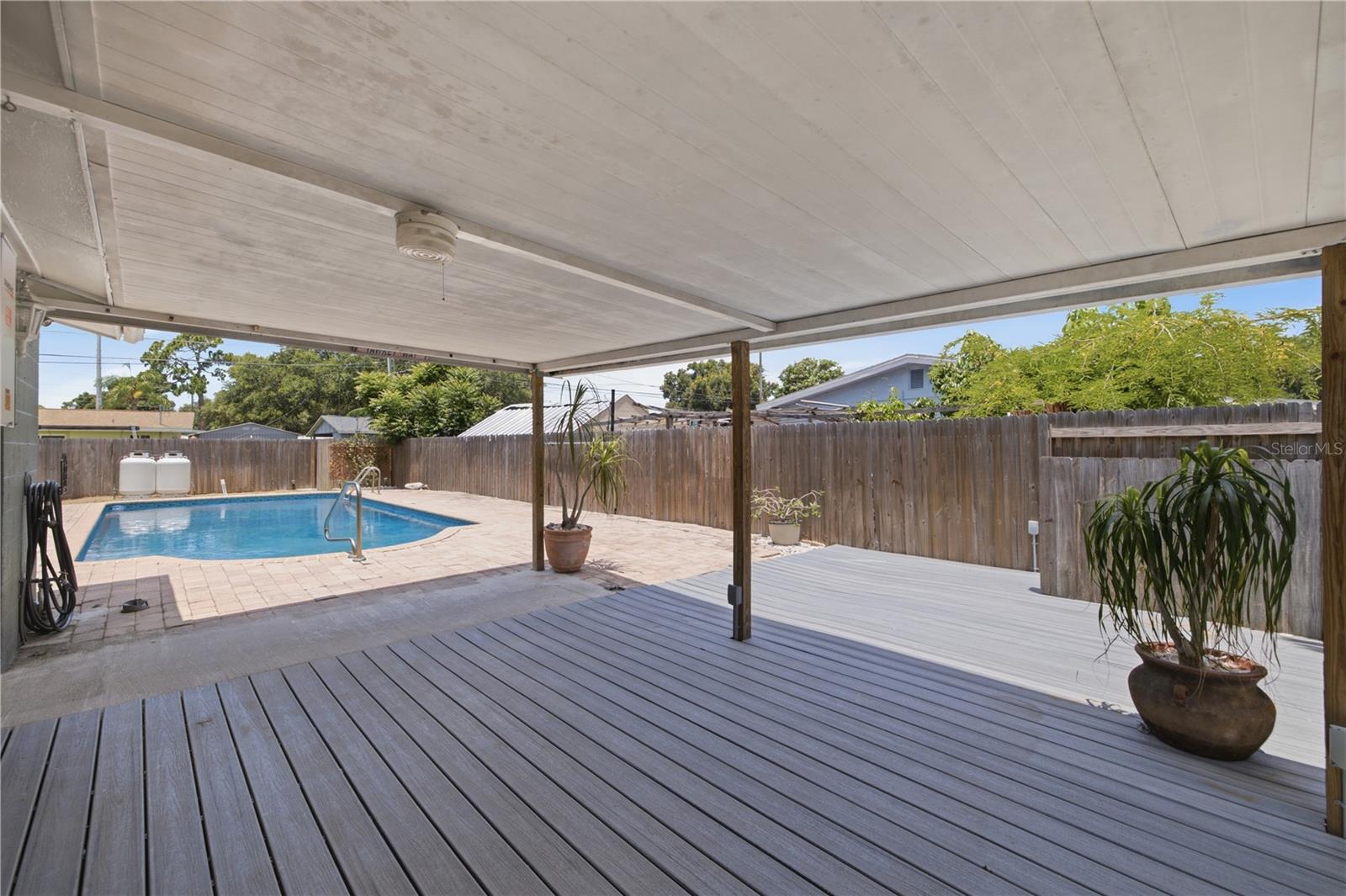 Spacious Covered deck off house next to pool