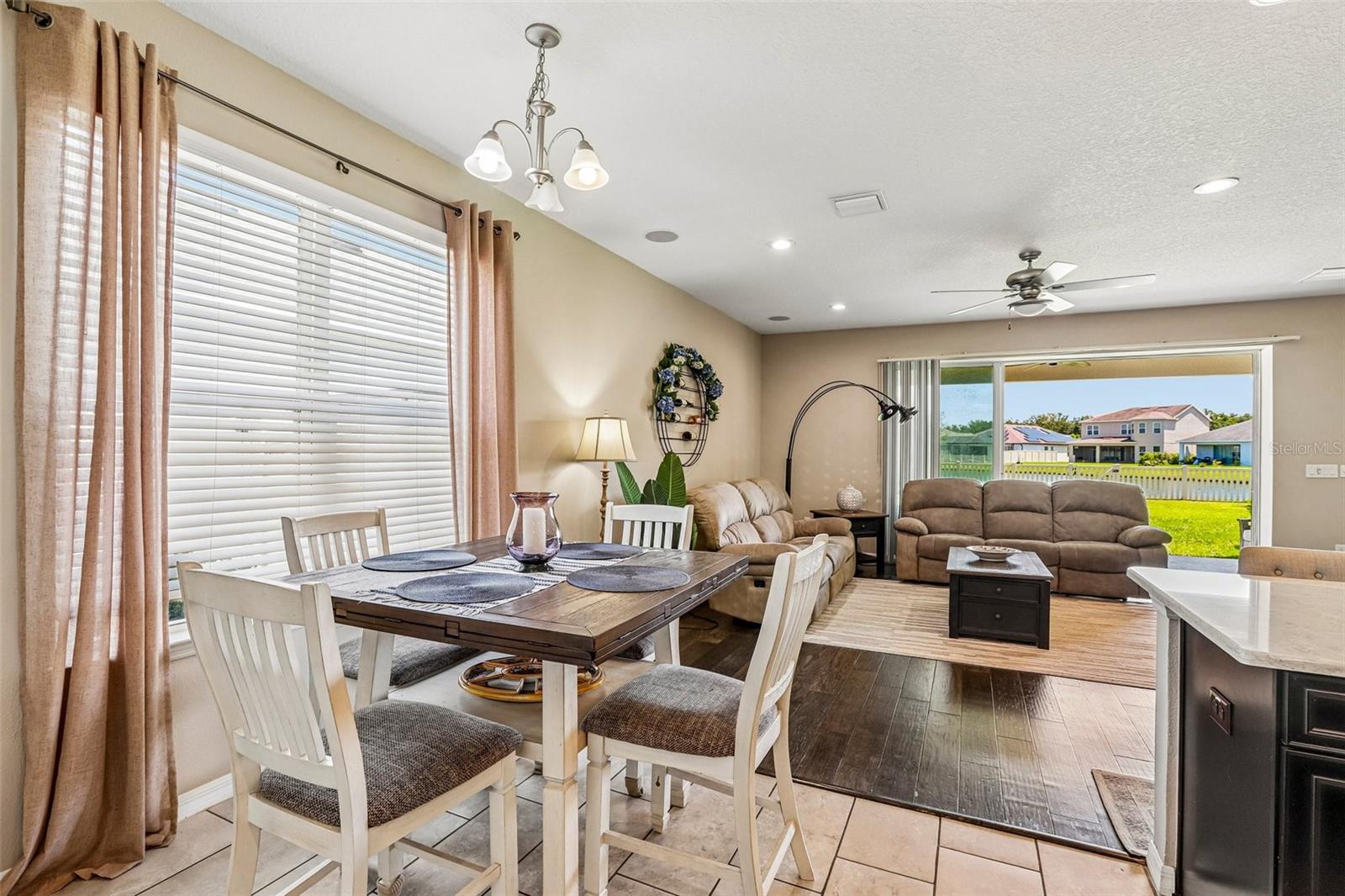Dinette area, off the kitchen, with open floor plan and view to back yard