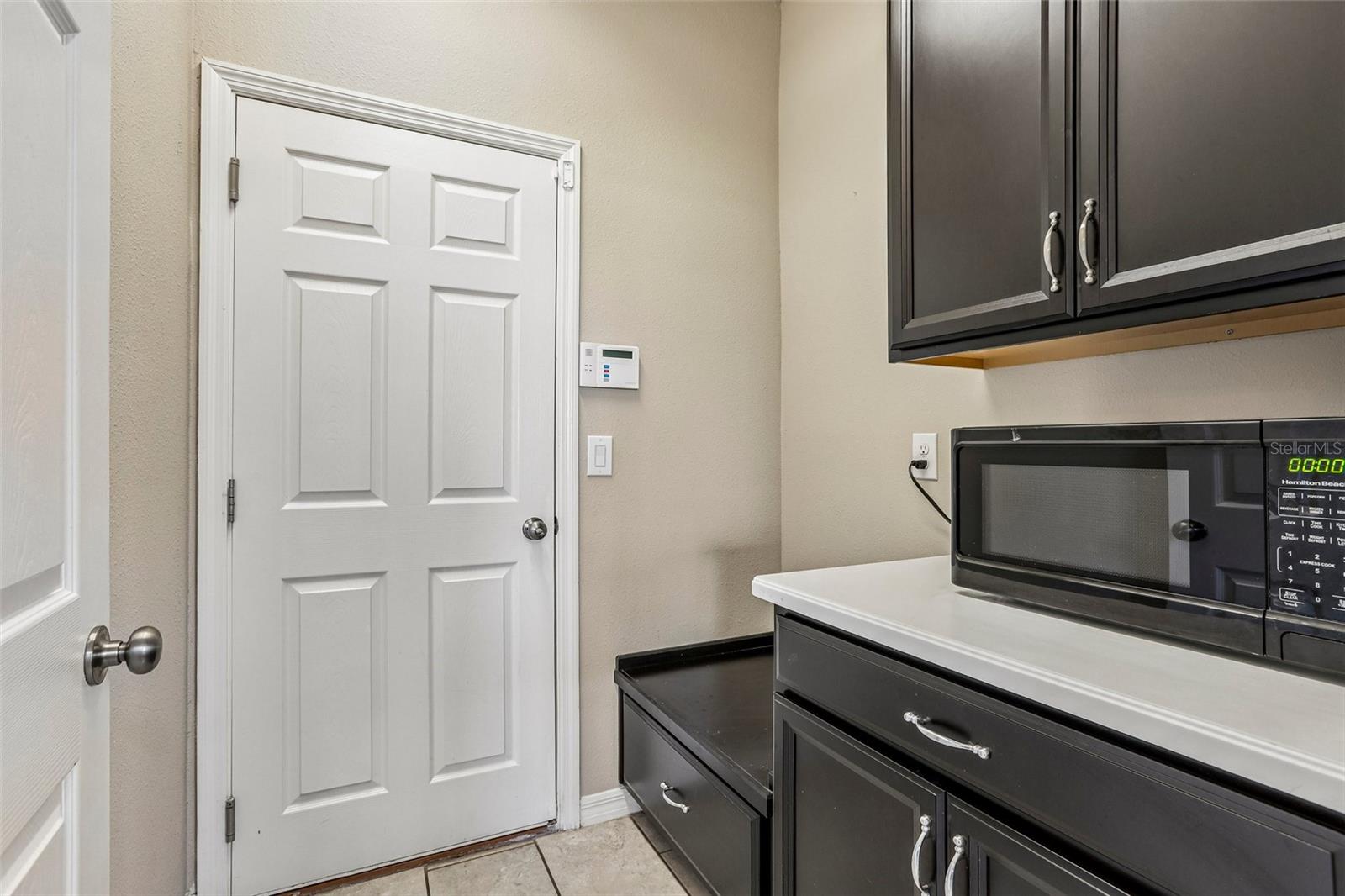 Downstairs Mudroom with custom cabinets