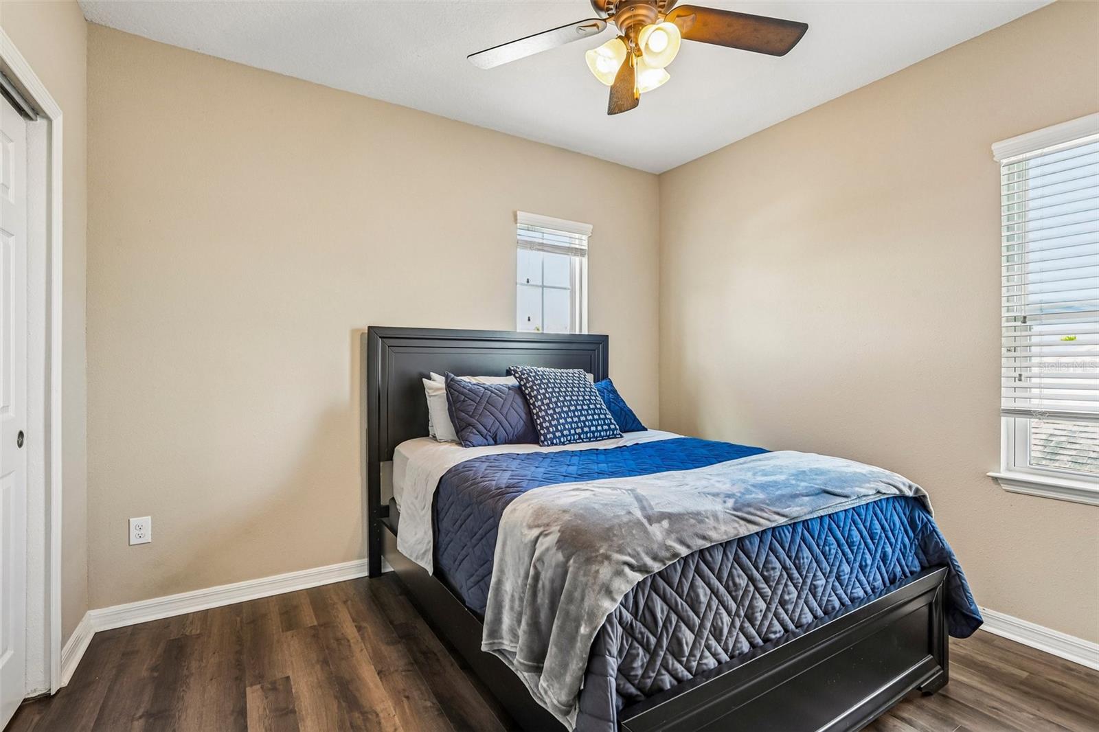 Bedroom 2 with laminate new laminate flooring,  large closet and access to jack and jill bathroom