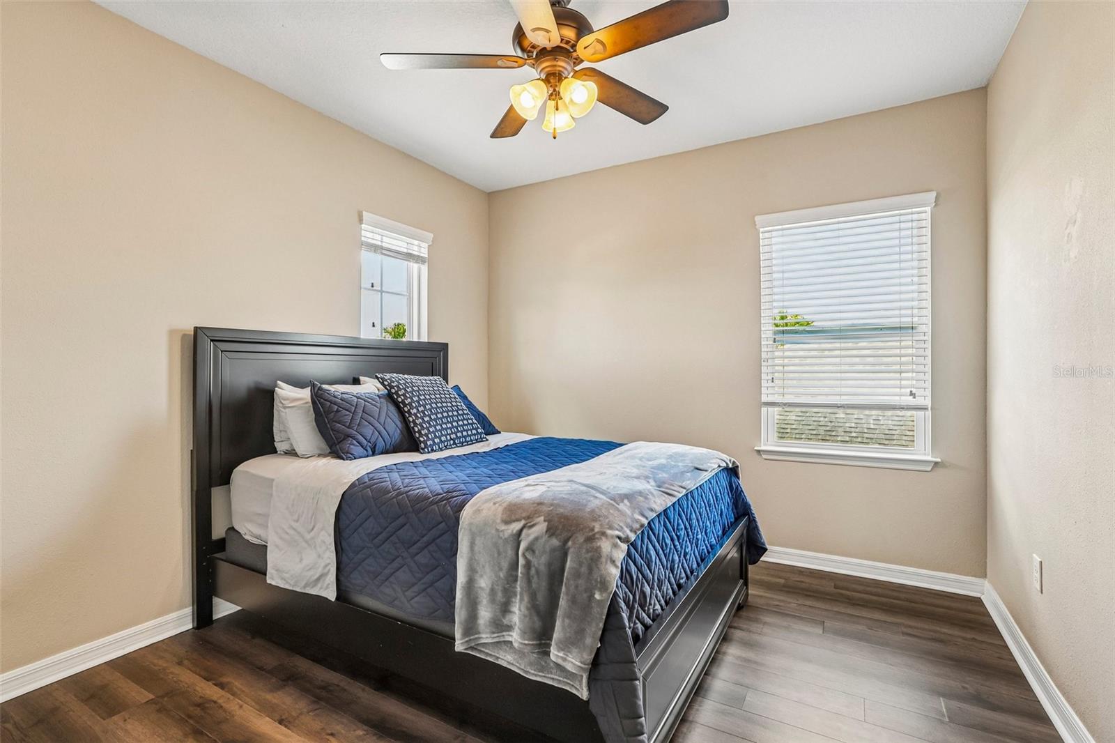 Bedroom 2 with laminate new laminate flooring,  large closet and access to jack and jill bathroom