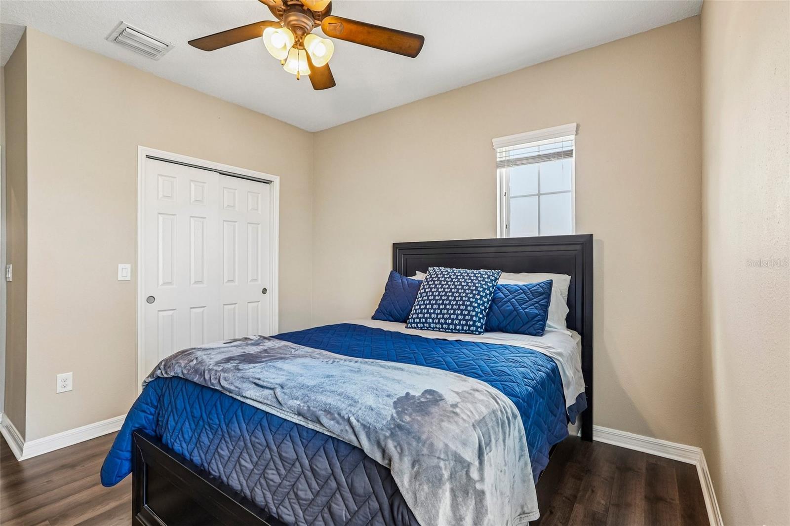 Bedroom 2 with laminate new laminate flooring,  large closet and access to jack and jill bathroom